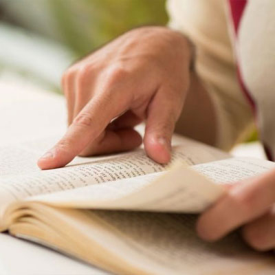 Close up of a person reading a book