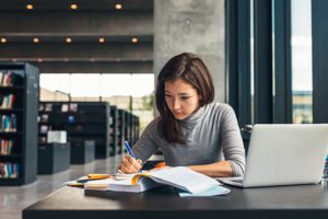 woman using ancestry library edition