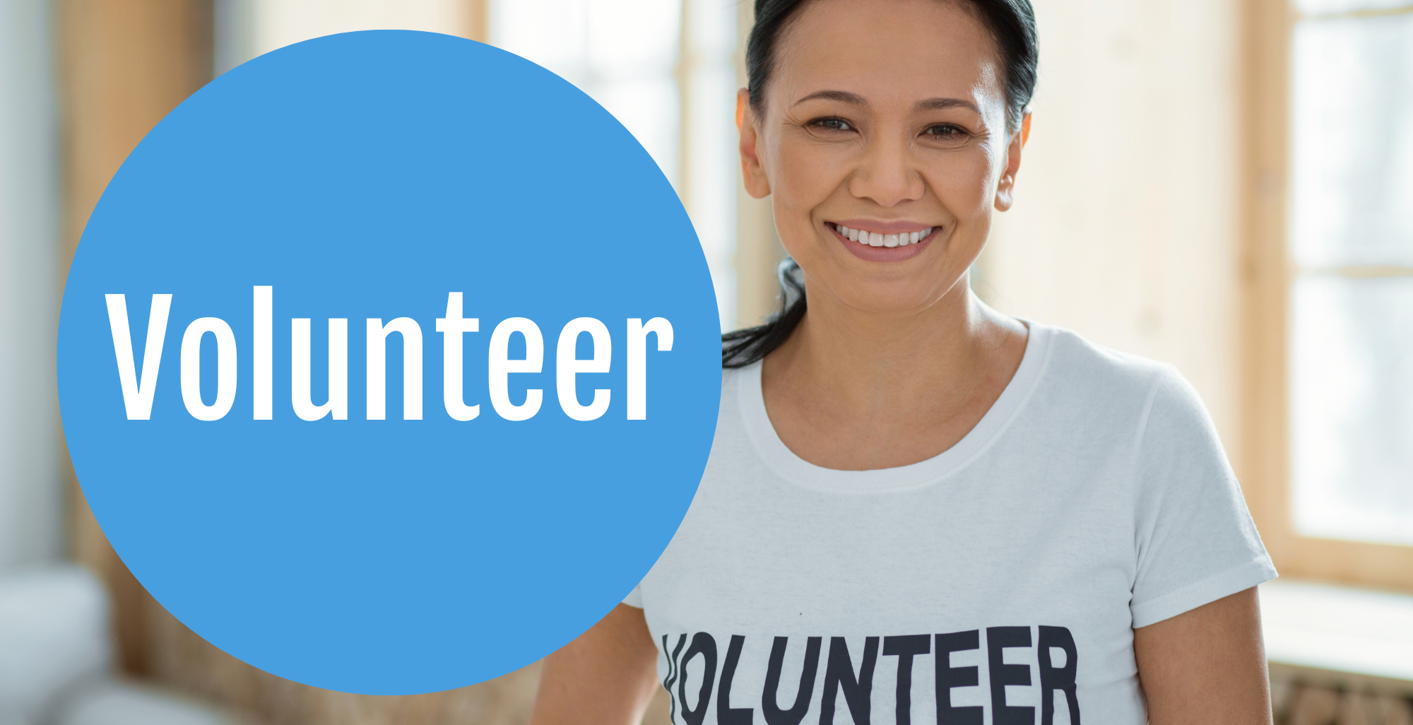 Smiling woman wearing a t-shirt that says "Volunteer"